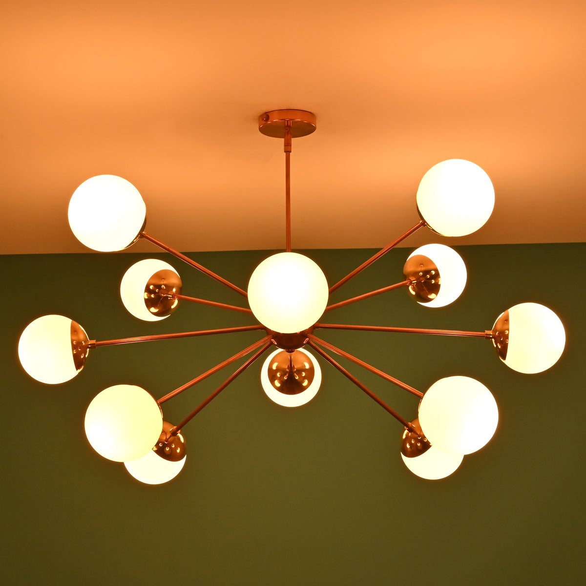 12 opal glass sputnik chandelier in copper brass tone finish with warm glowing globe shades