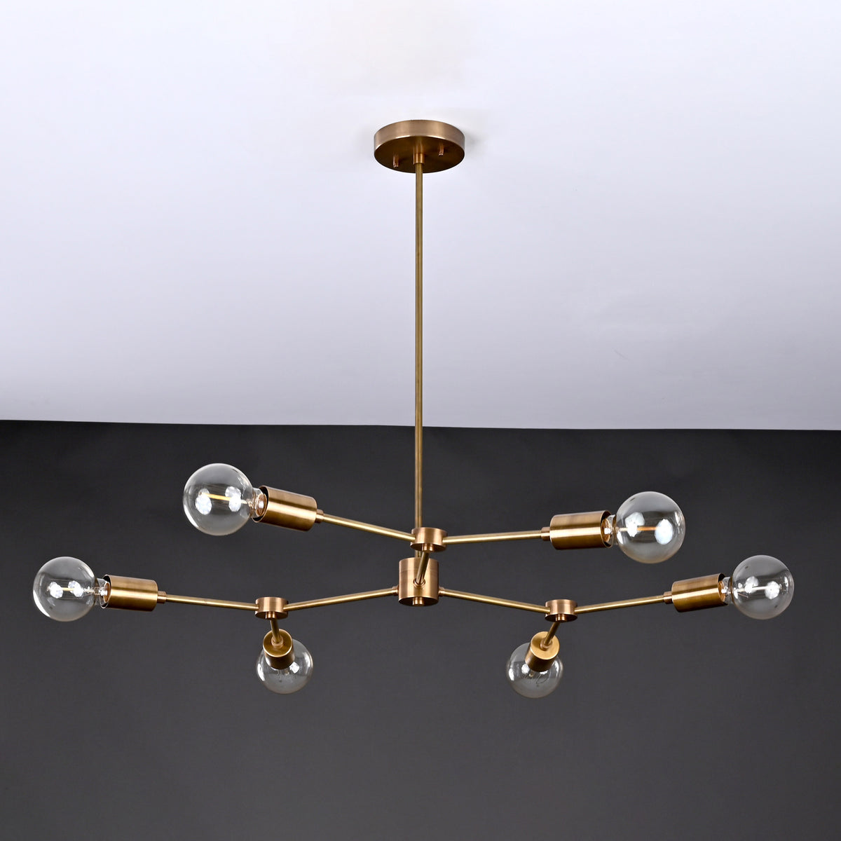 Modern 8-Light Brass Chandelier – Sculptural Ceiling Fixture with Industrial Globe Bulbs

 - 32214