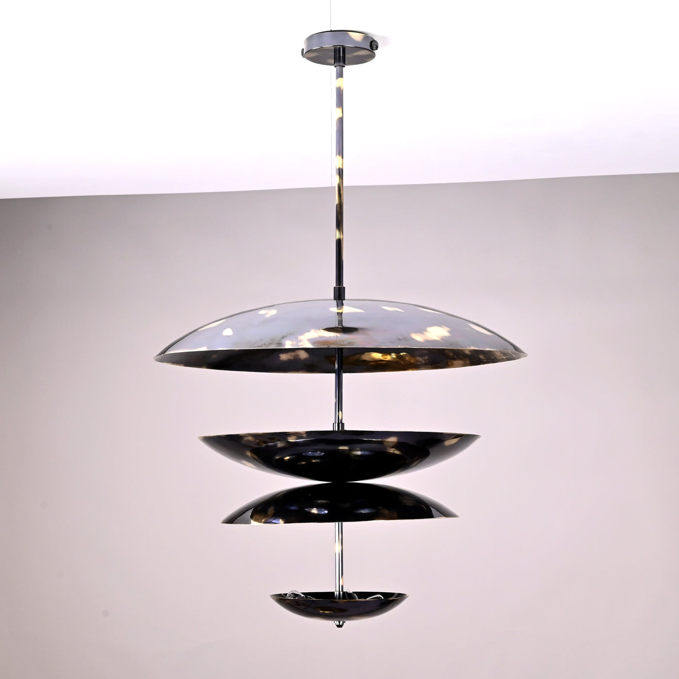 24-inch multi-tier brass disc chandelier with sculptural layered design and polished finish
