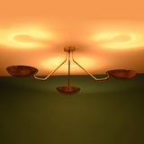 Unlit 3 light brass bowl flushmount ceiling fixture showing solid brass construction and minimalist form