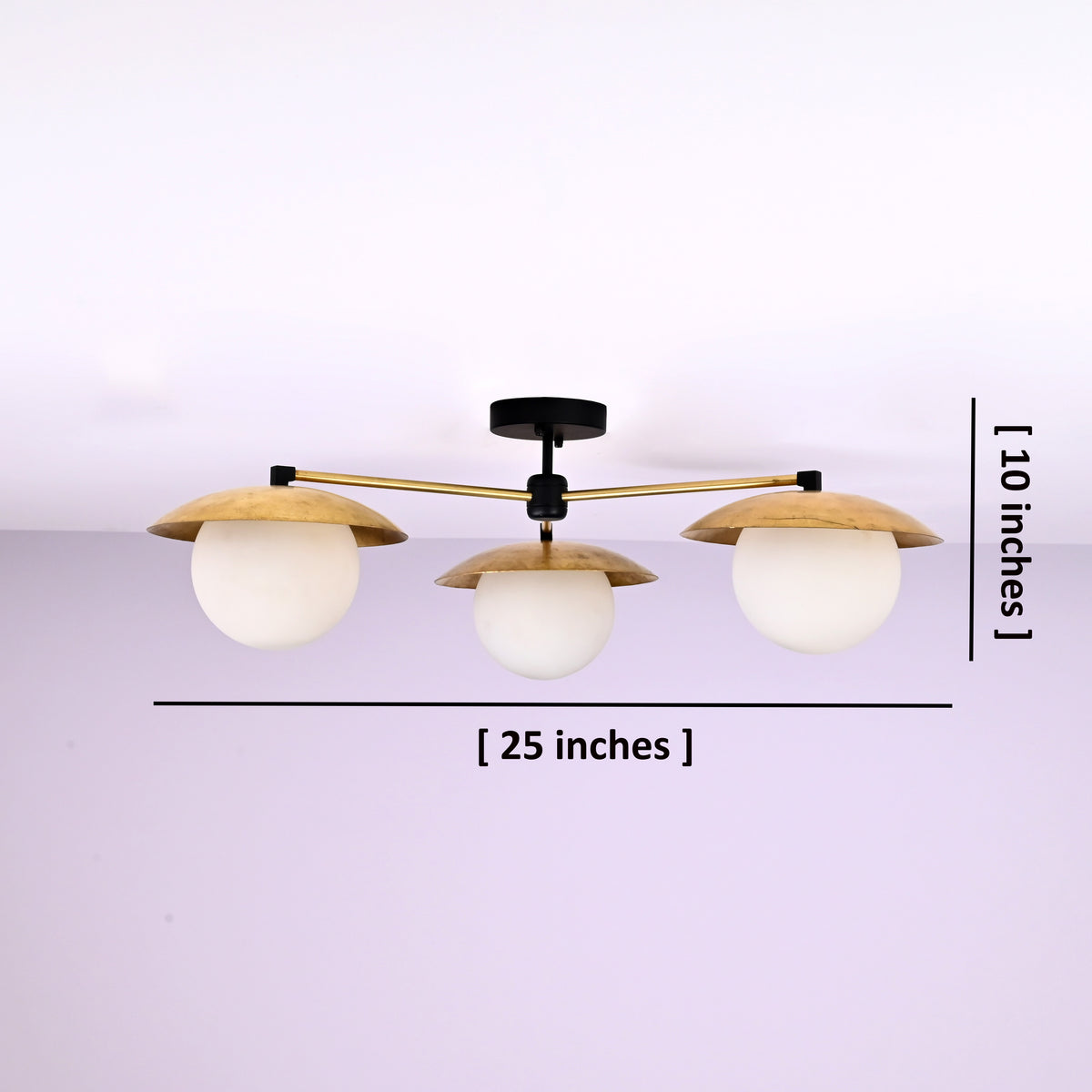 3 light brass disc flush mount ceiling light showing 25 inch width and 10 inch height with opal glass globes.