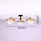 3 light brass disc flush mount ceiling light showing 25 inch width and 10 inch height with opal glass globes.