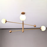 Minimalist brass chandelier with three opal glass globes, elegant ceiling light with customizable dimensions.