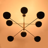 Contemporary Brass Pendant with Eight Black Shades – Top View Showing Geometric Design