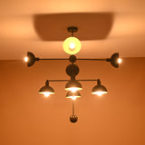 Illuminated 8-Light Brass Pendant – Black and Gold Chandelier with Warm Ambient Glow