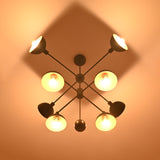 8-Light Brass Chandelier Top View – Geometric Black and Gold Pendant with Glowing Shades