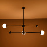 Warm-lit modern 3-light chandelier with linear matte black arms – horizontal view