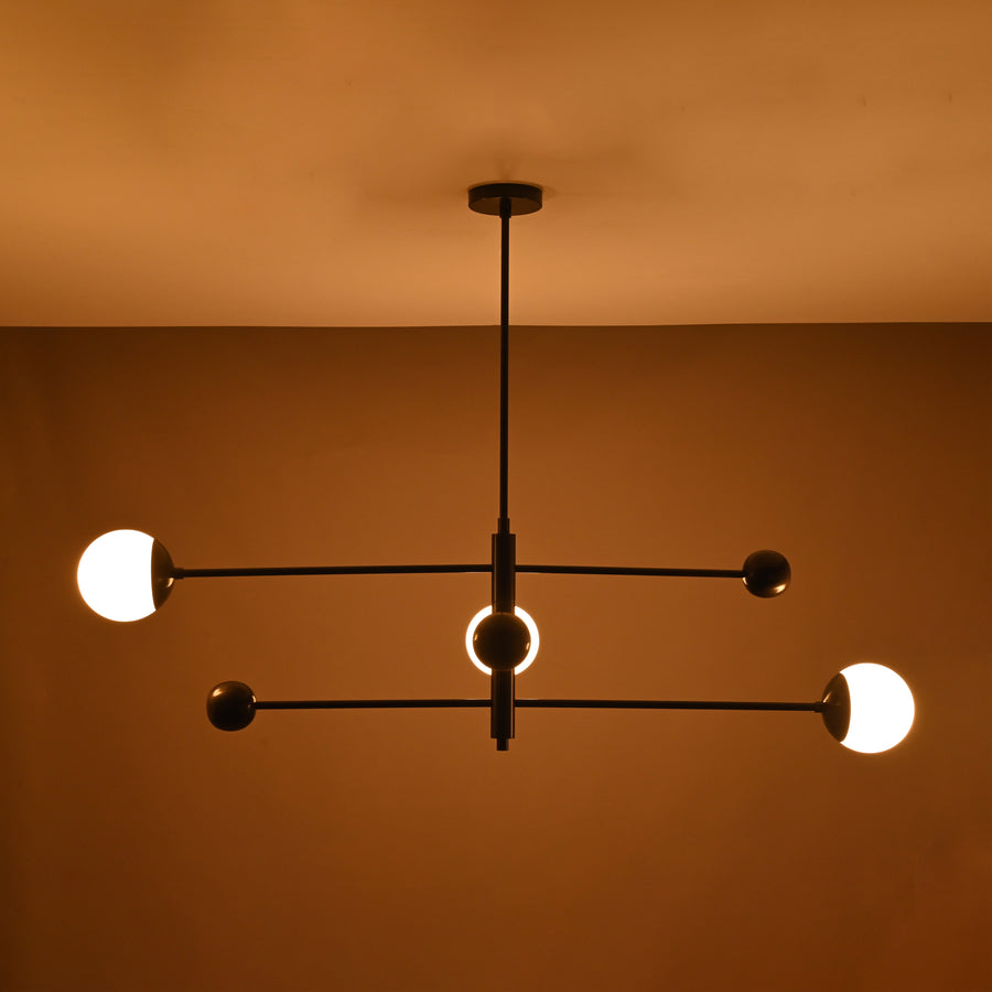 Minimalist matte black 3-light chandelier with balanced linear arms – upward view