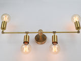 Modern four-light brass wall sconce with up-and-down lighting