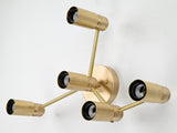 Modern geometric five-light wall sconce in brass