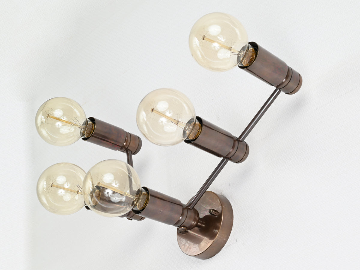 Symmetrical five-light wall-mounted brass fixture