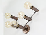 Symmetrical five-light wall-mounted brass fixture