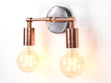 Compact two-light brass wall sconce with exposed bulbs