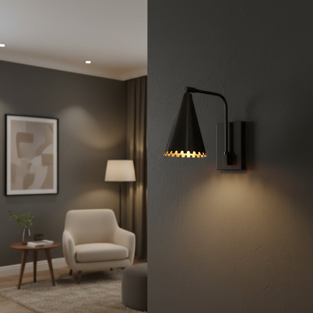 A modern beige armchair in a minimalist living room setting, styled with a matching throw pillow, a wooden sideboard, a black wall sconce, and a neutral abstract art print.