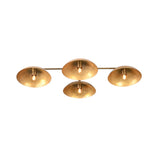 Symmetrical bottom view of 4 disc brass ceiling light highlighting evenly spaced bowl shaped shades