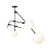 Side view of contemporary 4-light chandelier with balanced brass arms and white opal glass globes