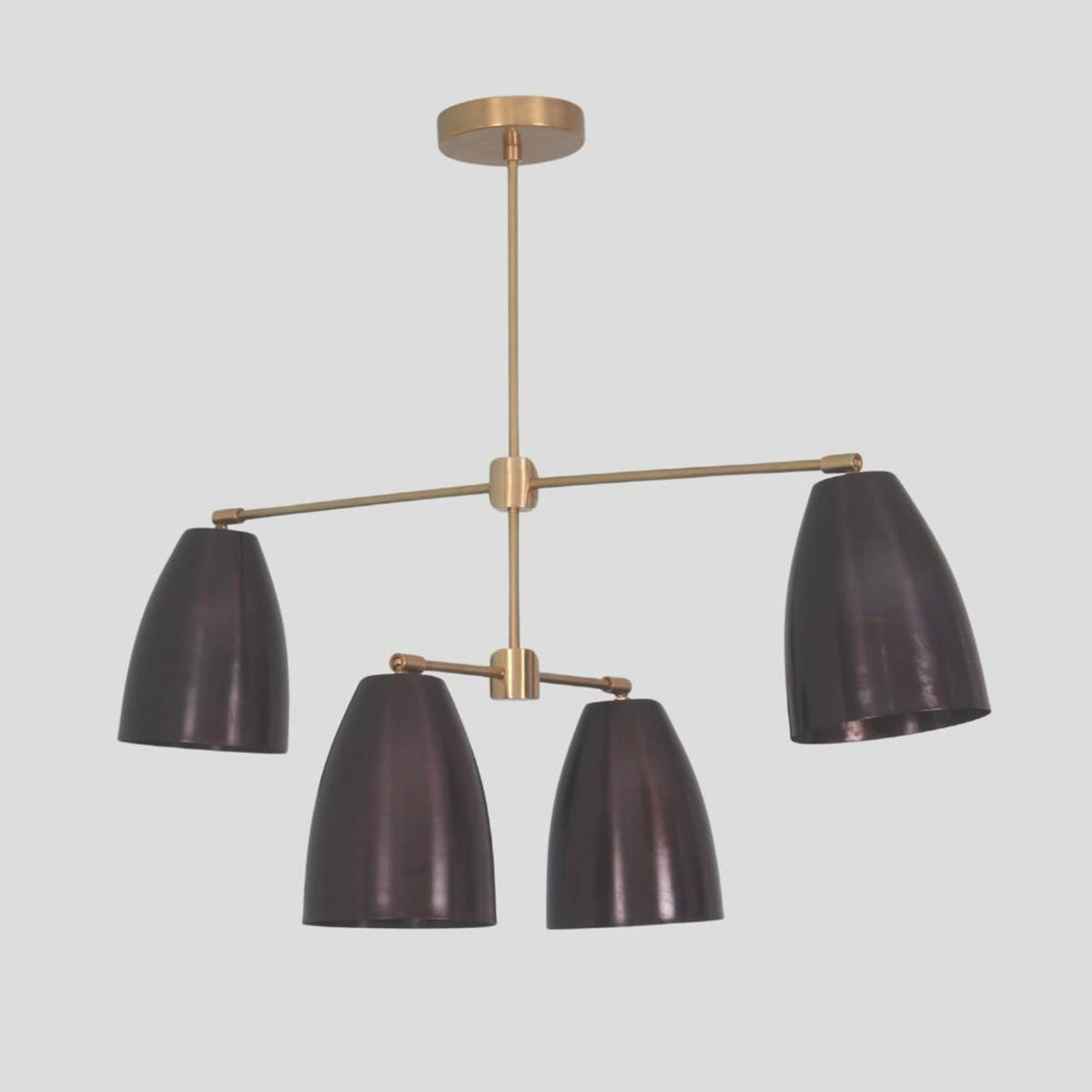 Close-up of handmade 4-light brass chandelier – solid brass frame with blackened cone shades and lacquer finish
