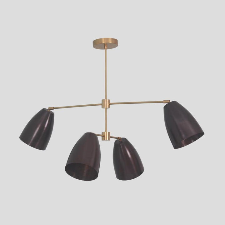 Handmade brass chandelier with four blackened cone shades – modern ceiling light with customizable finishes by Brass Leaf Studio