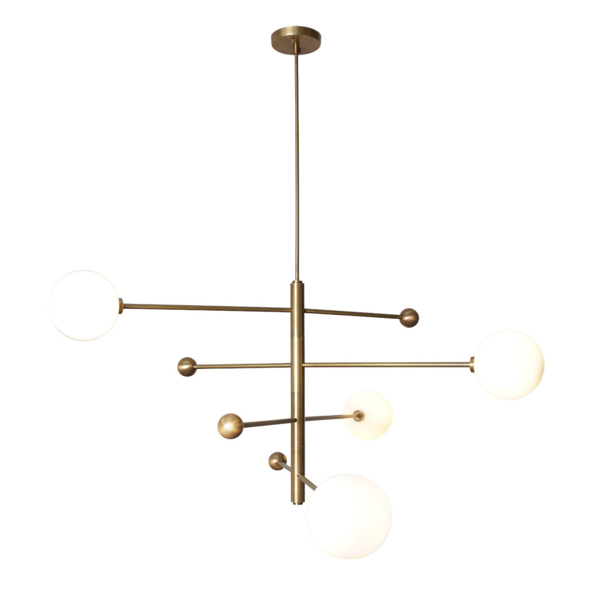 Contemporary 4 Light Brass Globe Chandelier featuring sleek brass structure and spherical white glass globes for elegant interior lighting