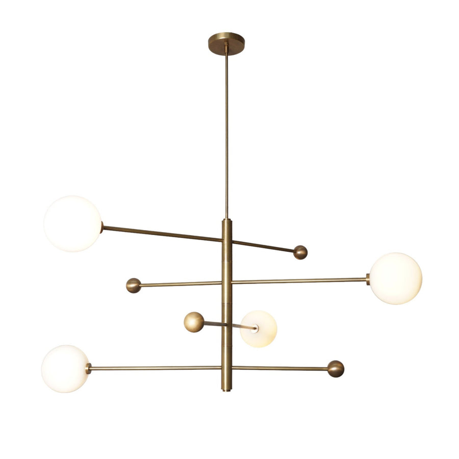 Contemporary 4 Light Brass Globe Chandelier featuring sleek brass structure and spherical white glass globes for elegant interior lighting