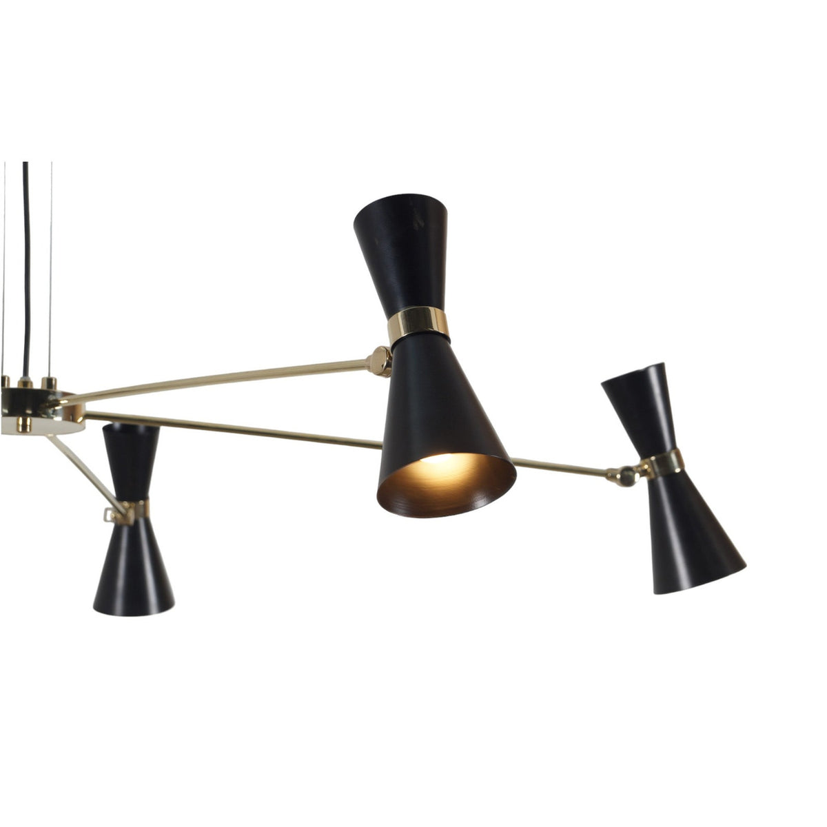 Close-up of black double-cone shade on 5-light brass chandelier showing handcrafted brass detailing and lacquer finish
