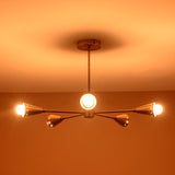 Elegant mid-century brass cone ceiling light glowing warmly against neutral ceiling, handmade by Brass Leaf Studio for timeless modern interiors.