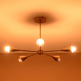 Bottom view of glowing 5-light brass cone chandelier, showing perfect arm balance and polished brass finish craftsmanship.
