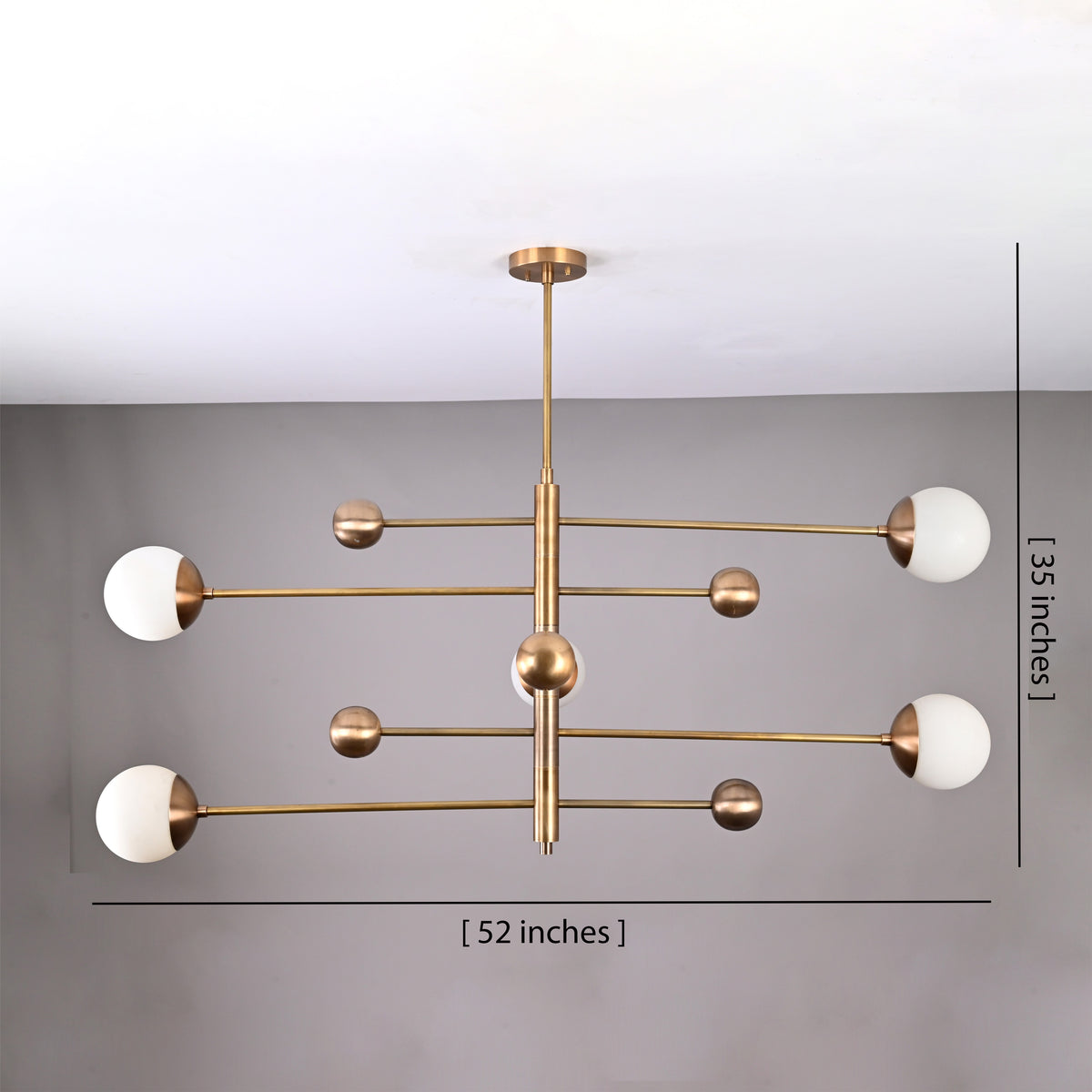 Dimensional view of 5-light brass chandelier showing 52-inch width and 35-inch height with opal glass globes.