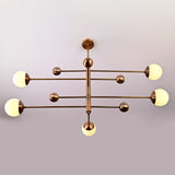 Five light globe chandelier product view with opal glass shades and modern linear brass frame