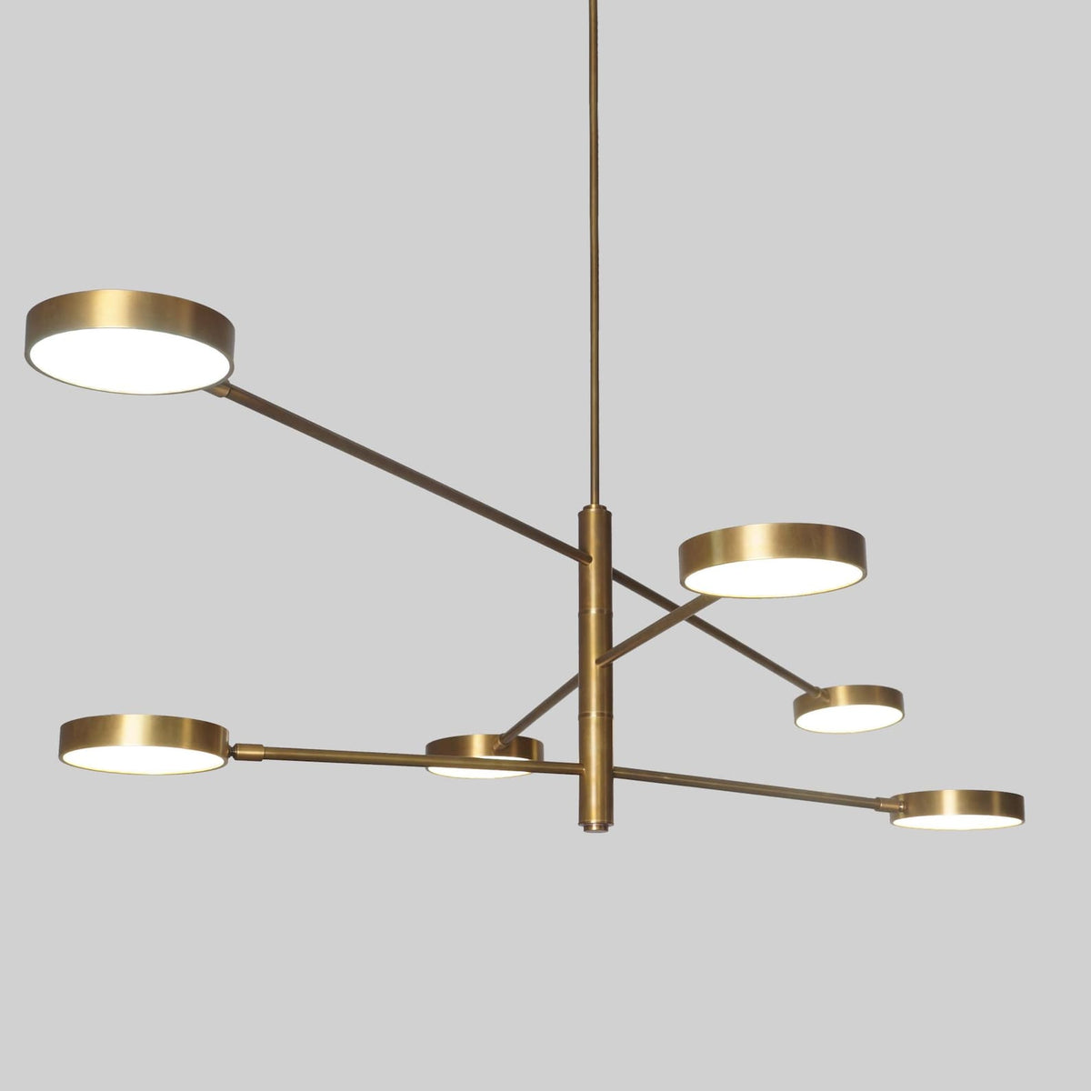 Close-up of 6 Disc Arm Brass Chandelier showing linear brass detailing and elegant disc-shaped lights – modern home lighting design