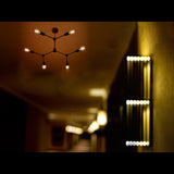 Modern 8-Light Brass Chandelier – Sculptural Ceiling Fixture with Industrial Globe Bulbs

 - 32214