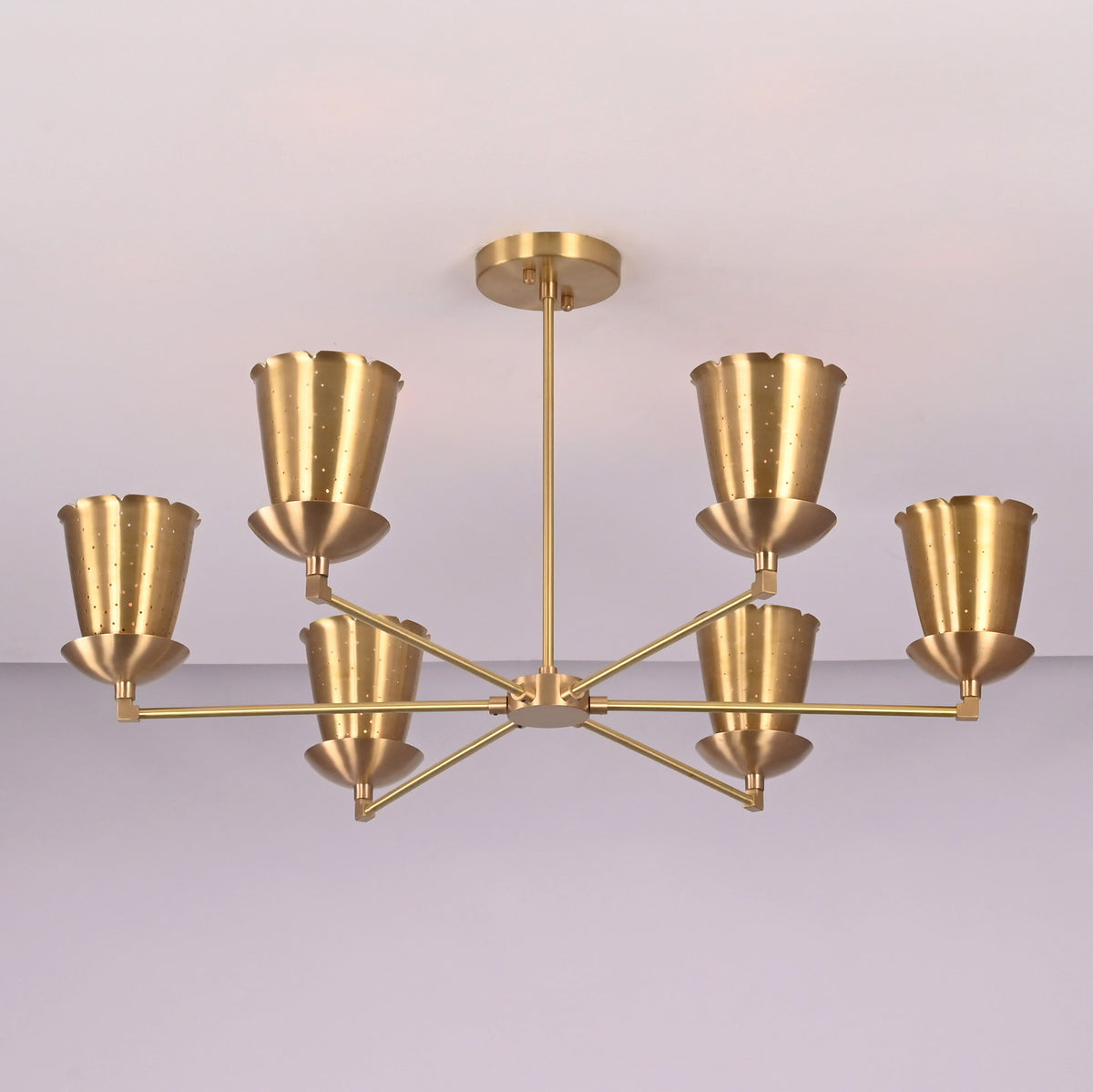 Angled view of handcrafted 6 light brass cone shade chandelier with symmetrical arms and minimalist industrial design.