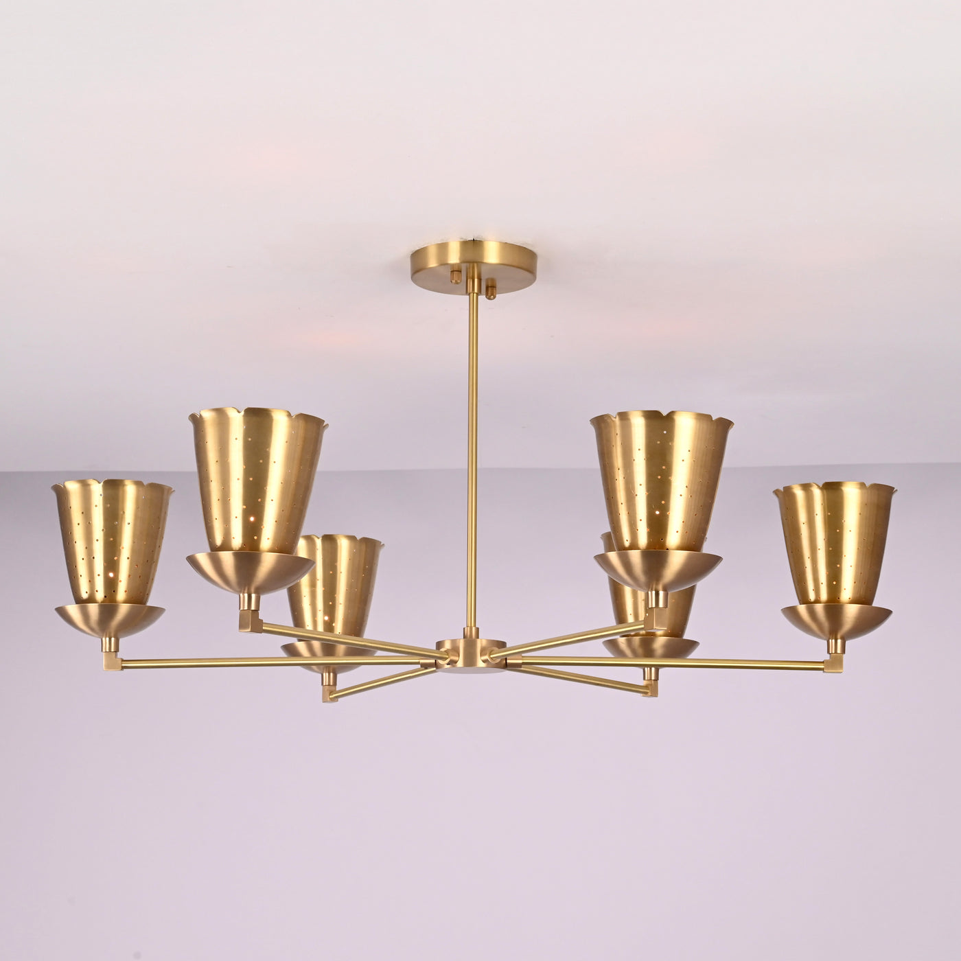 Front view of 6 light brass cone shade chandelier with sculpted arms and brushed brass finish, handcrafted by Brass Leaf Studio for warm ambient lighting.
