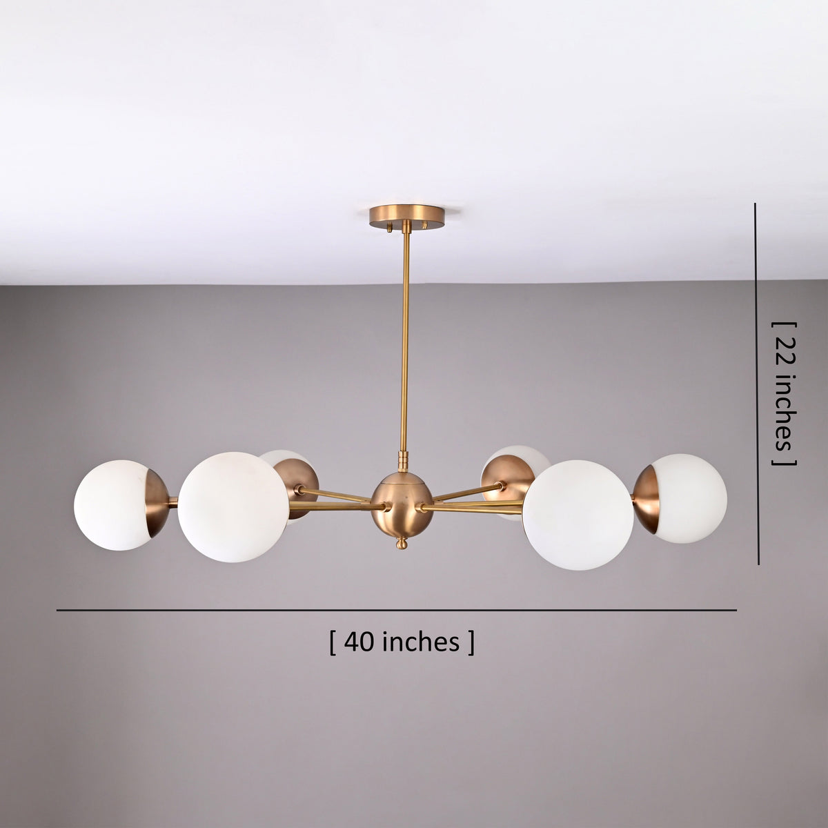 Modern 6-light brass chandelier with frosted glass globes, 40-inch wide handcrafted brass ceiling light.