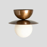 Side view of brass double bowl flush mount ceiling light with opal globe – contemporary handmade ceiling lighting.