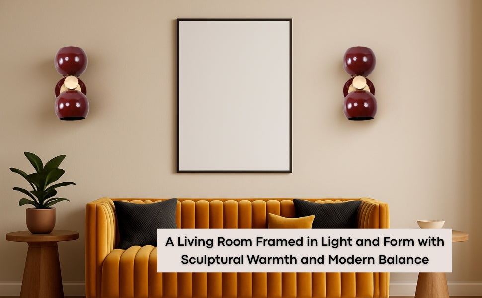 Living room scene with Brass Leaf Studio burgundy double globe wall sconces flanking artwork above a mustard sofa.
