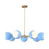 Front view of 7 bowl blue glass chandelier in solid brass providing warm ambient lighting