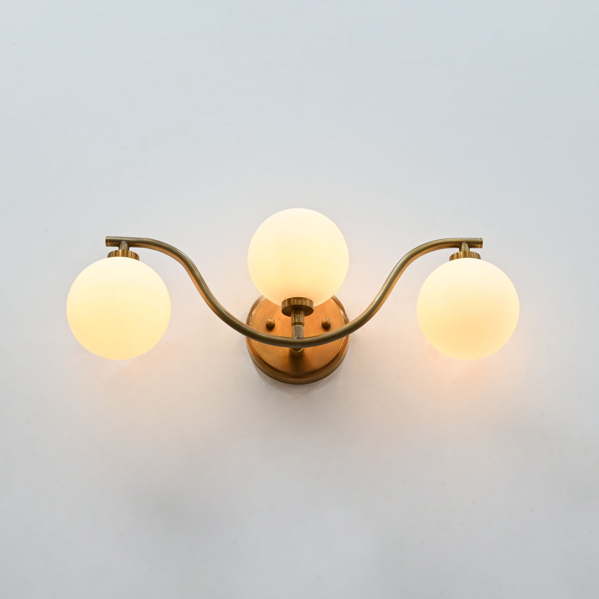 Sorrento Triple Globe Brass Wall Sconce – Brass Patina Vanity & Bedroom Light 72253