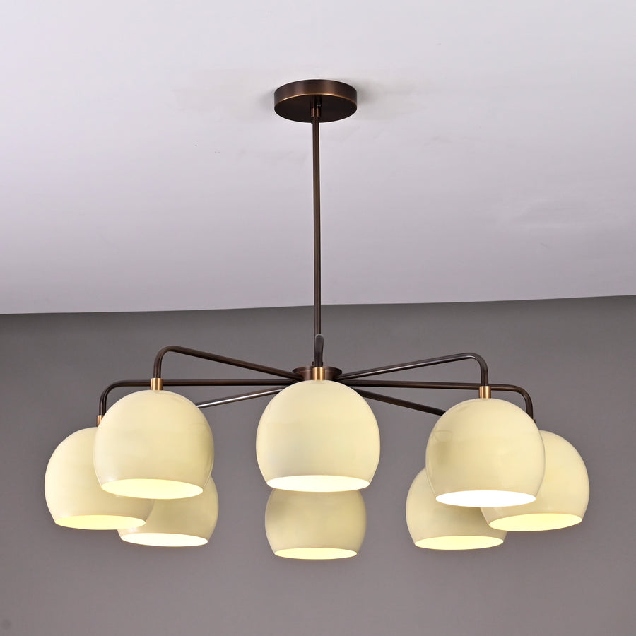 Front view of handcrafted 8-light brass chandelier with ivory bowl shades and bronze finish by Brass Leaf Studio.