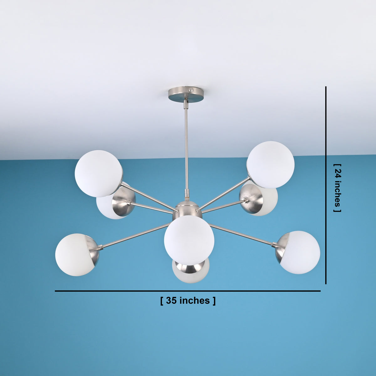 8 light brass globe chandelier showing 35 inch width and 24 inch height with modern mid century design
