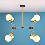 Side profile of an 8-light brass globe chandelier showing linear arm structure, opal glass shades, and black accent joints.