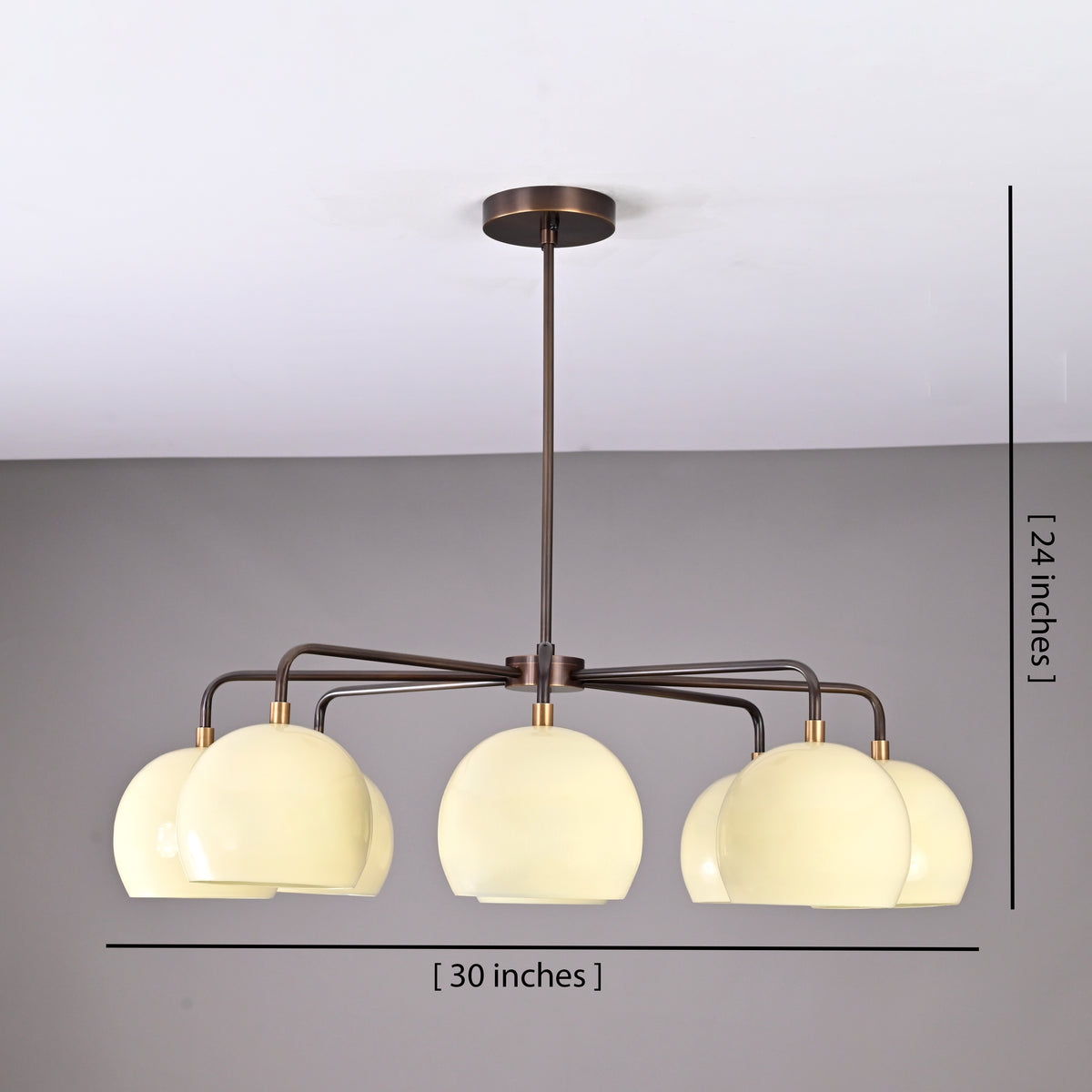 Modern 8-light brass chandelier showing 30-inch width and 24-inch height dimensions with cream bowl-shaped shades.