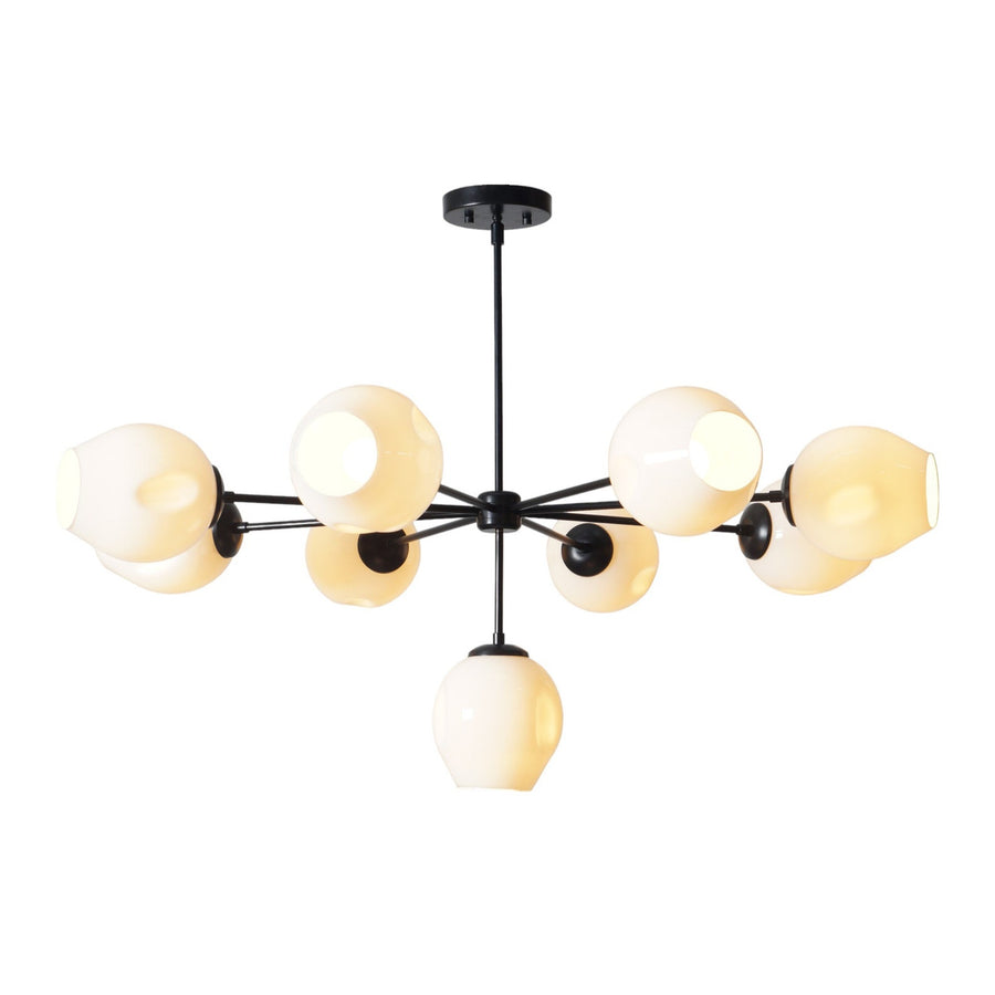 9-light modern brass chandelier with sculpted white shades and black frame by Brass Leaf Studio