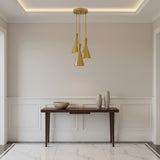 Adelaide 3 light brass-tone cluster chandelier shown from the front with elongated cone shades arranged at staggered heights.