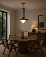 Alden 1-light industrial dome pendant chandelier displayed above a round dining table in a warm modern dining room – Model 33185
