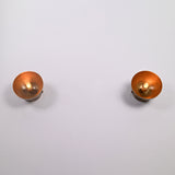 Pair of Alden Modern Dome Wall Sconces with exposed bulbs, showcasing handcrafted dome shades in a symmetrical front-facing arrangement.