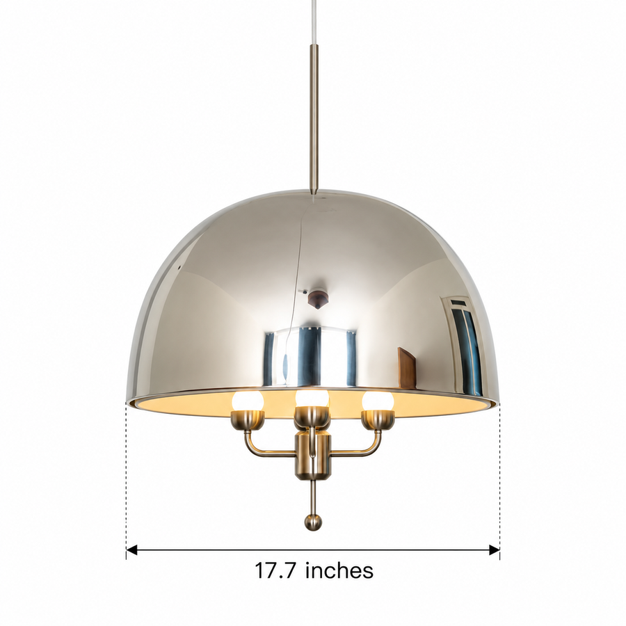 Alexandria polished chrome dome pendant illuminating a luxurious contemporary living room with a cream sectional sofa, round walnut coffee table, warm wooden shelving, and evening city skyline views.