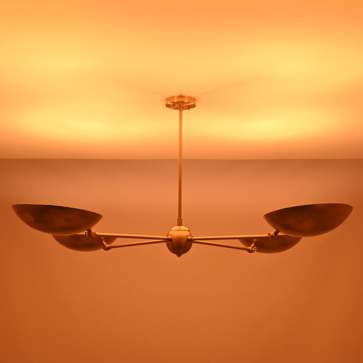 Side view of the Hudson Modern Quad Bowl Chandelier highlighting illuminated handcrafted bowl shades and elegant Mid-Century Modern styling.