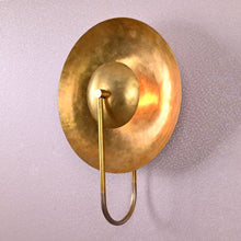 Handmade brass wall sconce with curved U-shaped arm and bowl shade, modern luxury lighting design