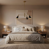 Antwerp 3 light asymmetrical chandelier shown from a side angle with tapered black metal shades and brass arms.